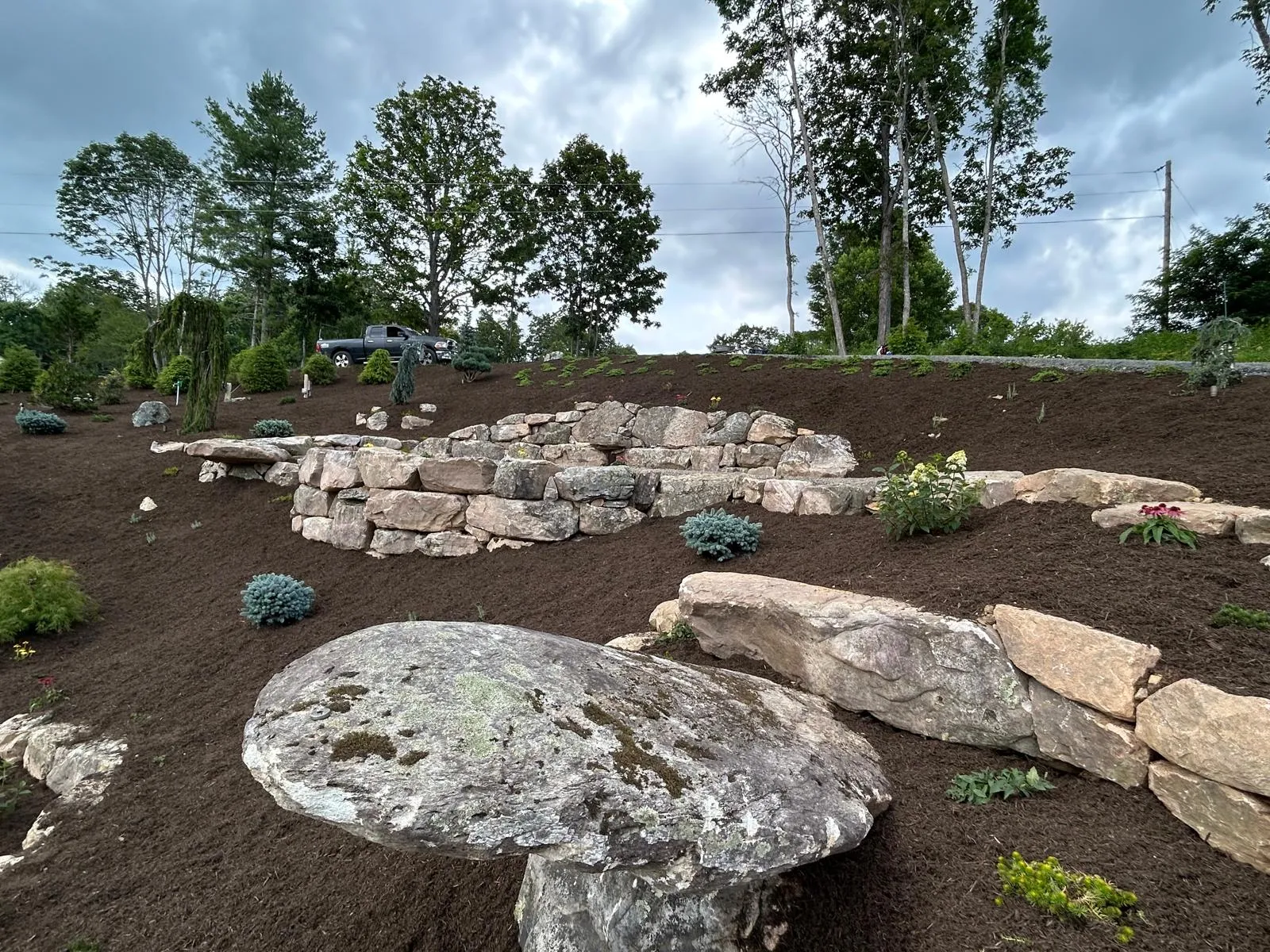 Boulder landscaping and stonework with a long-range mountain view in Boone, NC
